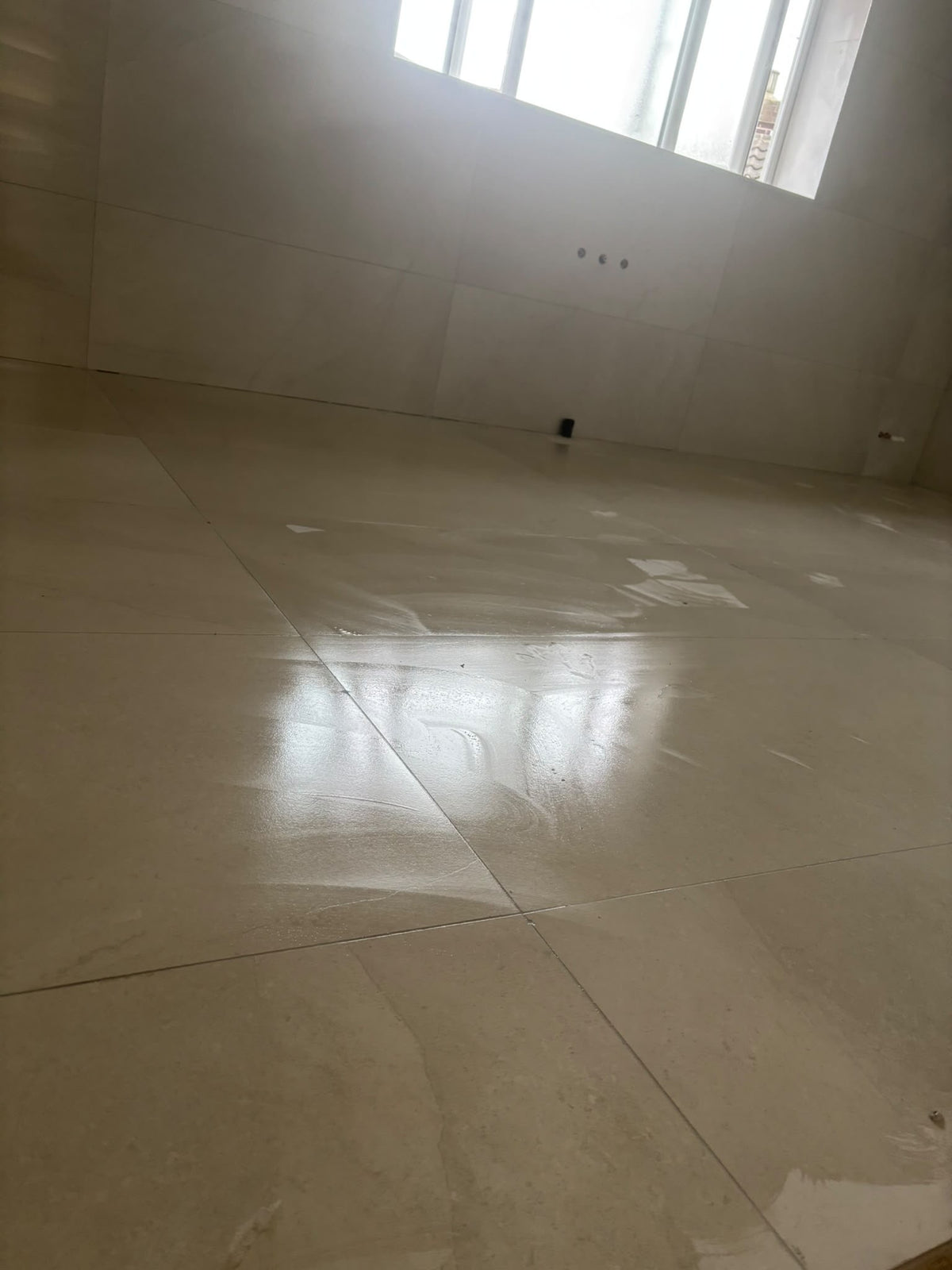 Contemporary tiled floor kitchen splashback and interior feature wall