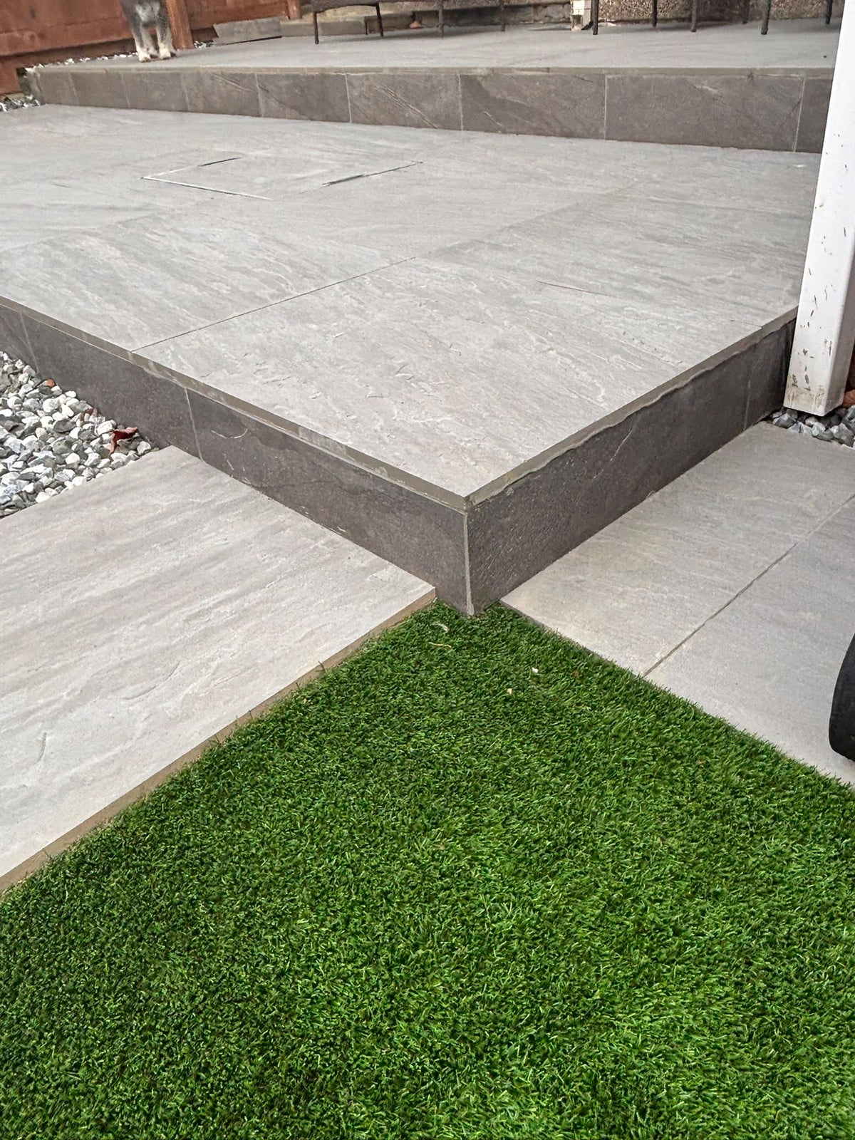 Contemporary garden patio finished in large-format outdoor porcelain tiling